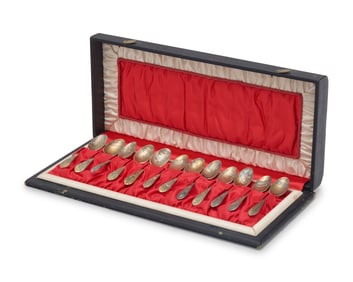 A Cased Set of Twelve Aesthetic Gilt-Washed Sterling Silver Coffee Spoons