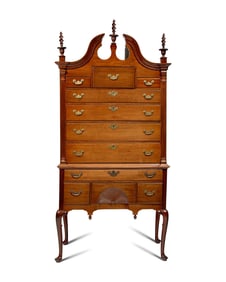 A Queen Anne Carved Walnut Bonnet-Top High Chest of Drawers