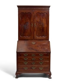 A Chippendale Figured and Carved Walnut Desk-and-Bookcase