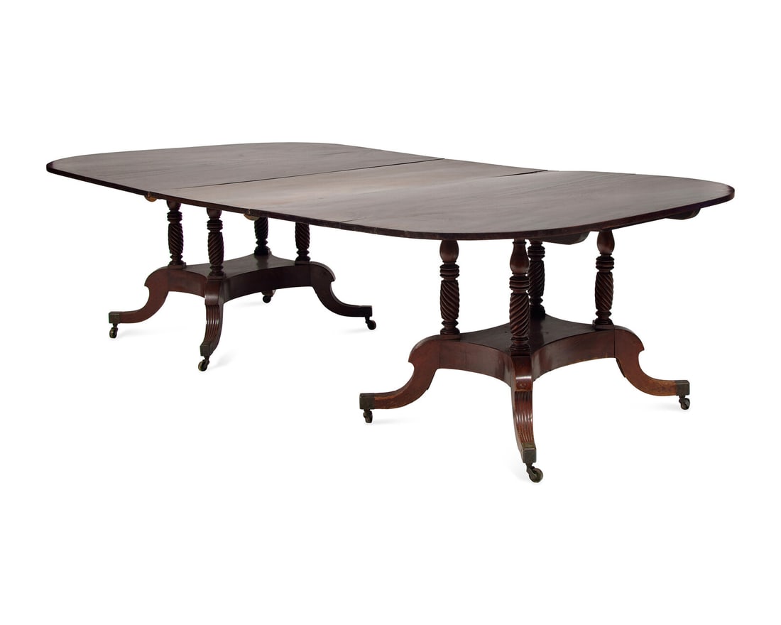 A Late Federal Two-Part Carved Mahogany Dining Table: A Late Federal Two-Part Carved Mahogany Dining Table By Tradition Attributed to Duncan Phyfe (1768-1854), New York, New York, Early 19th Century with one leaf and brass clips. Height 29 x width 55 x d