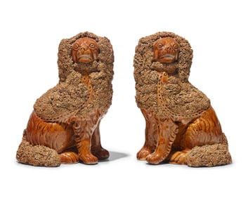 A Scarce Pair of Rockingham Glazed Spaniels