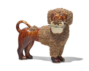 A Bennington Glazed Spaniel with Basket