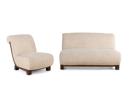 A Contemporary Upholstered Loveseat and Slipper Chair: A Contemporary Upholstered Loveseat and Slipper Chair Height of loveseat 29 1/2 x width 52x depth 38 inches; Height of chair 29 1/2 x width 23 1/3 x depth 38 inches. The Collection of Robert and