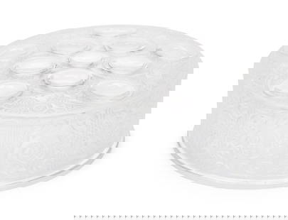 A Lalique Roger Powder Box: A Lalique Roger Powder Box marked 'Lalique France' to underside. Height 2 x diameter 5 1/2 inches. Property from the Collection of Eileen and Richard Schilling, Rockford, Illinois This lot is