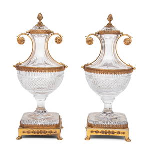 A Pair of Gilt Metal Mounted Cut Gass Urns: A Pair of Gilt Metal Mounted Cut Gass Urns 20th Century Height 16 x width 7 1/4 x depth 6 1/2 inches. Property from the Collection of Eileen and Richard Schilling, Rockford, Illinois This lot is