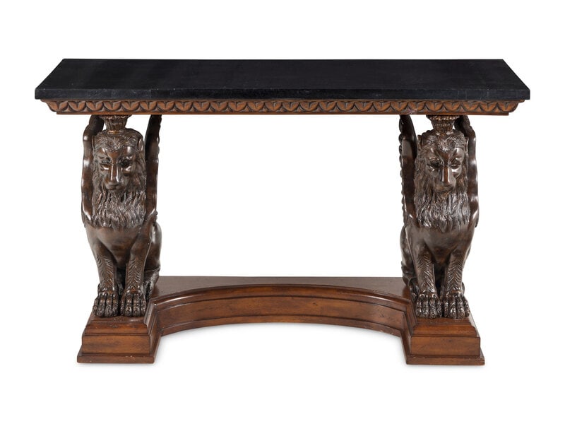 A Carved Wood Console Table with Lion Supports: A Carved Wood Console Table with Lion Supports 20th Century Height 36 x width 62 x depth 20 inches. This lot is located in Chicago.