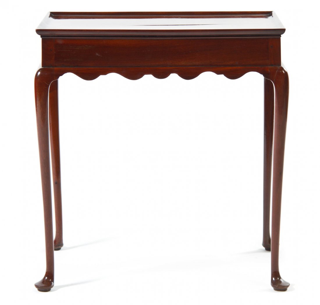 A Queen Anne Mahogany Tea Table, Height 25 3/4 x width : A Queen Anne Mahogany Tea Table, 18th or early 19th century, likely of Boston manufacture, having a rectangular dished top over a plain frieze and a cyma curved apron, raised on cabriole legs terminat