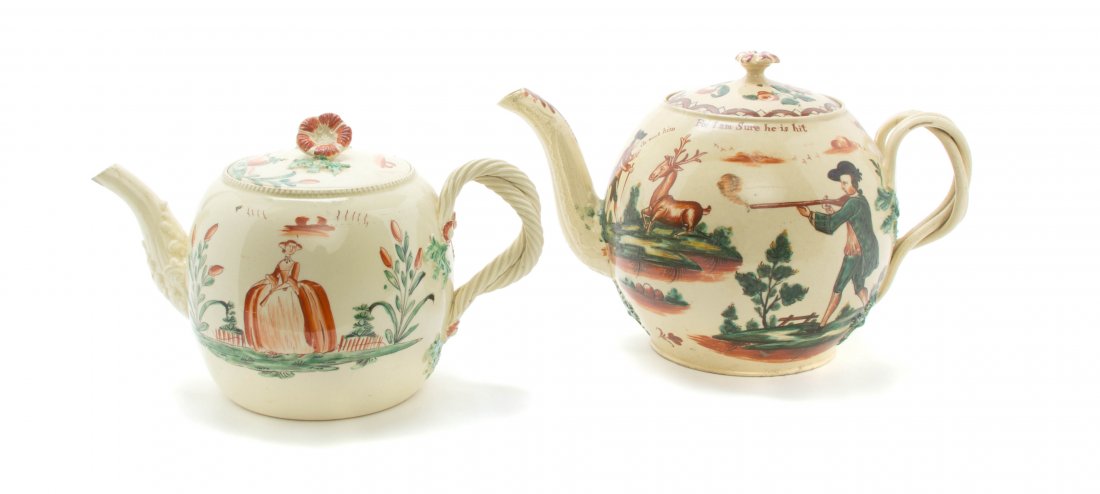 Two English Creamware Teapots, Height of taller 6 3/8 i: Two English Creamware Teapots, 18th century, each having a flower finial, applied entwined handles and molded spouts, the bodies with polychrome figural and scenic decoration with various sayings, unm