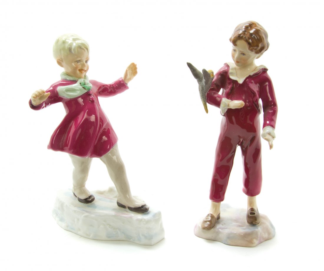 Two Royal Worcester Porcelain Figures, Height of taller: Two Royal Worcester Porcelain Figures, depicting a boy and a girl, each raised on a naturalistic base. Height of taller 6 3/4 inches.