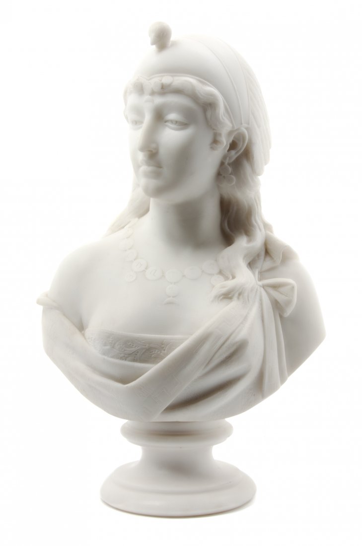 An Italian Carved Marble Bust, Eduardo del Santa, Heigh: An Italian Carved Marble Bust, Eduardo del Santa, late 19th century, depicting an Orientalist maiden wearing a bird form headdress and a coin necklace, inscribed E. del Santa to verso, raised on a tur