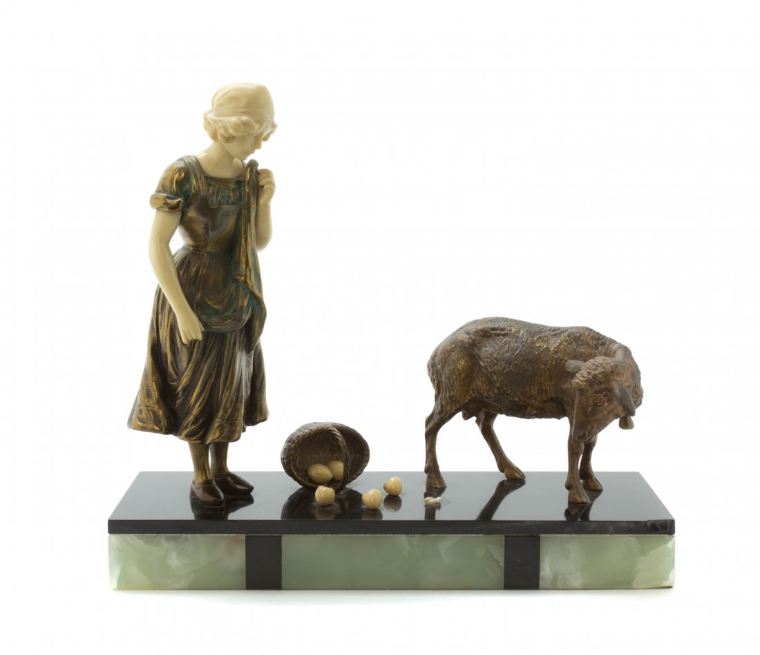 A French Art Deco Cast Metal Figural Group, Height 12 x: A French Art Deco Cast Metal Figural Group, depicting a girl with sheep and broken eggs, having composite head and arms, set on an onyx veneered base, stamped Made in France. Height 12 x width 13 inch