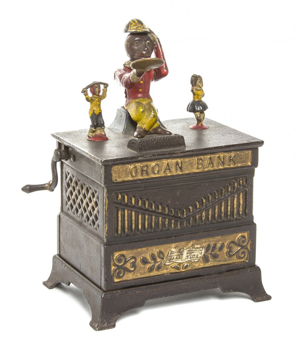 An American Cast Iron and Polychrome Painted Mechanical: An American Cast Iron and Polychrome Painted Mechanical Bank, Kyser & Rex, Organ Bank, depicting a seated monkey flanked by a dancing boy and girl figure, raised on the naturalistic organ shaped base,