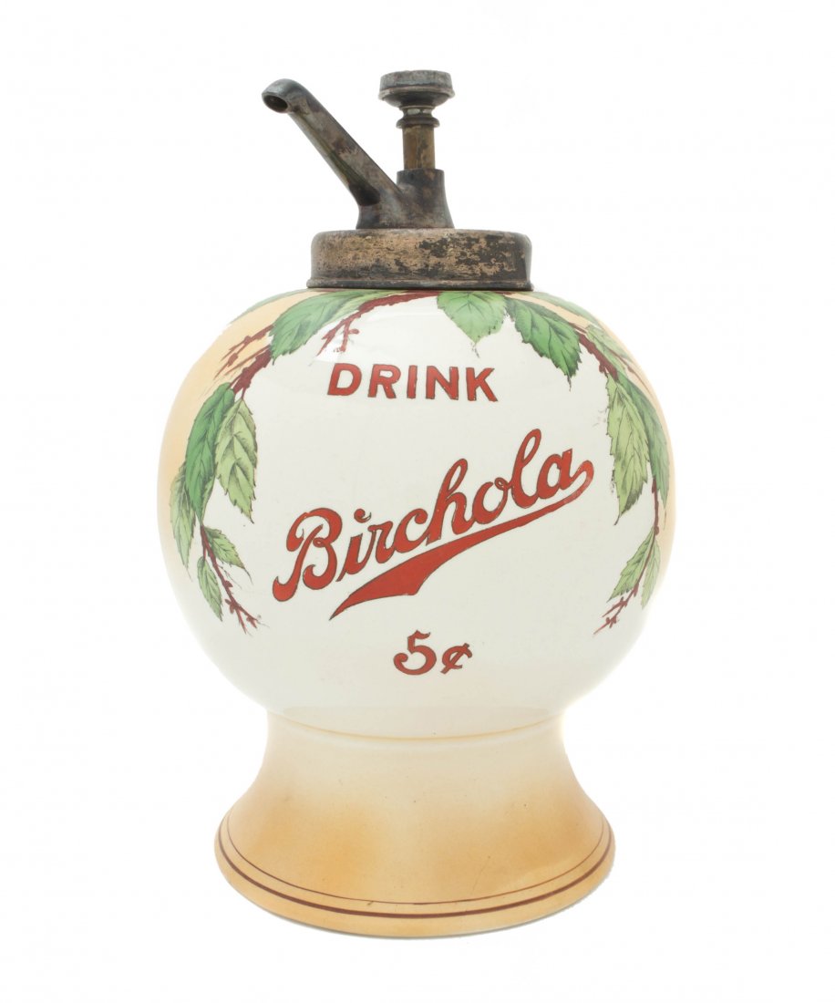 An American Ceramic Birchola Syrup Dispenser, Height ov: An American Ceramic Birchola Syrup Dispenser, of spherical form decorated with birch leaves and the text Drink Birchola 5?, the base marked Loaned for dispensing Birchola only, the Birchola Co. Dickso