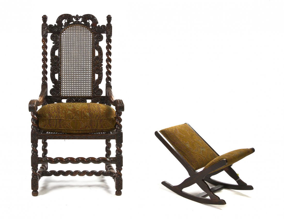 A Renaissance Revival Walnut Open Armchair, Height 48 7: A Renaissance Revival Walnut Open Armchair, having a pierce carved crest flanked by finials over the caned back and seat, raised on twist and block legs joined by stretchers, the whole with carved fol