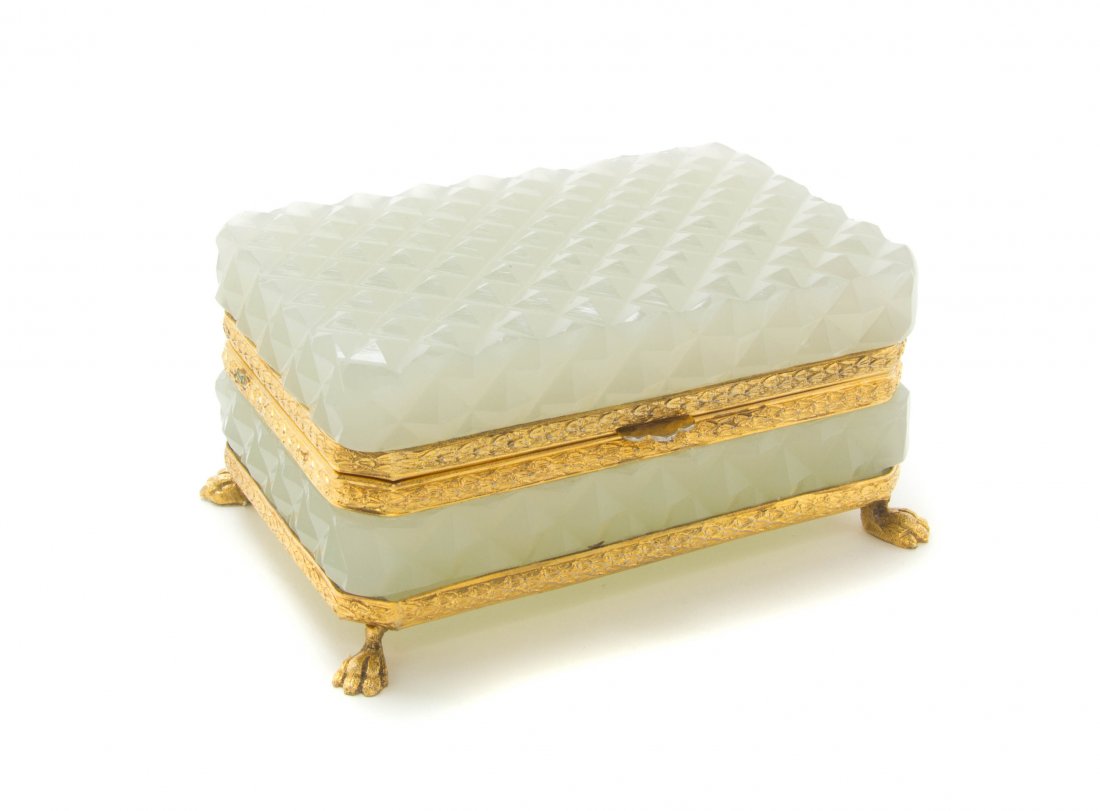 A French Opaline Glass and Gilt Metal Mounted Box, Widt: A French Opaline Glass and Gilt Metal Mounted Box, of rectangular form with a hinged lid having all over diamond cut decoration, raised on paw feet. Width 5 1/4 inches.