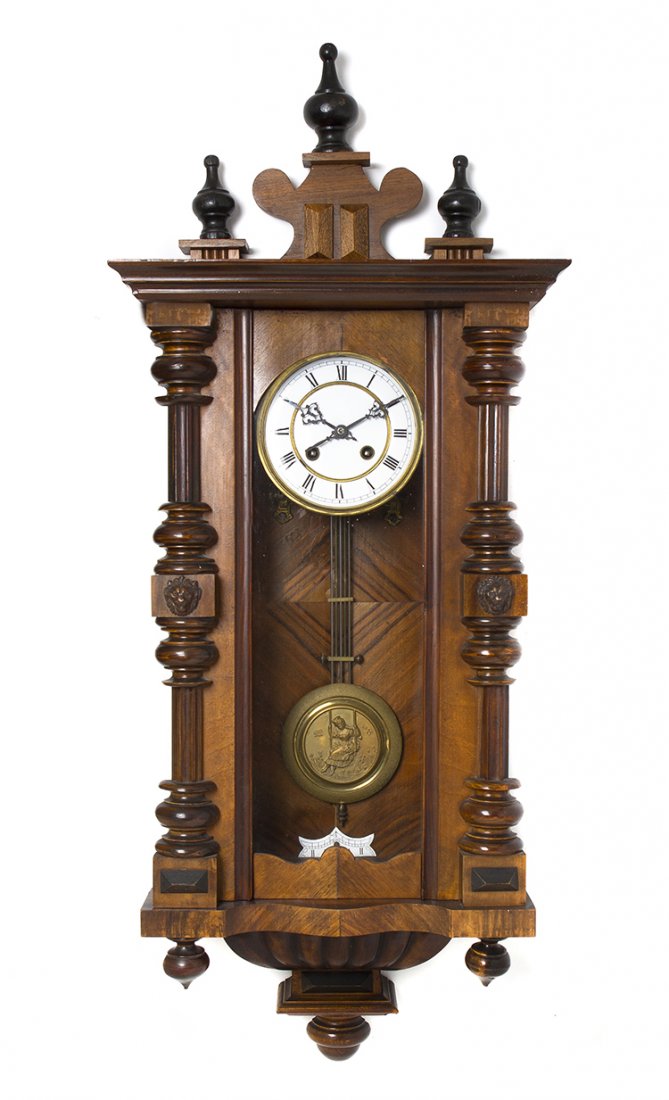 A Viennese Walnut Regulator Clock, Height 39 inches.: A Viennese Walnut Regulator Clock, having a rectangular case fitted with a circular dial having Roman hours, the pendulum with relief decoration depicting a girl on a swing, having time and strike mov