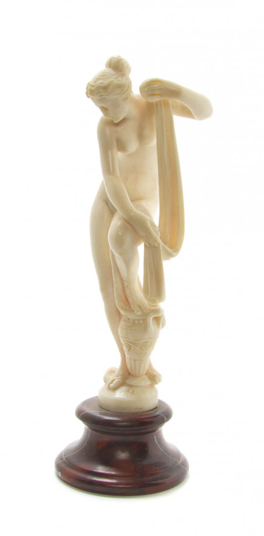 A Continental Ivory Figure, Height overall 6 5/8 inches: A Continental Ivory Figure, depicting Venus at her bath, raised on a rouge marble socle. Height overall 6 5/8 inches. Property from the Estate of George B. Chapman, Chicago, Illinois