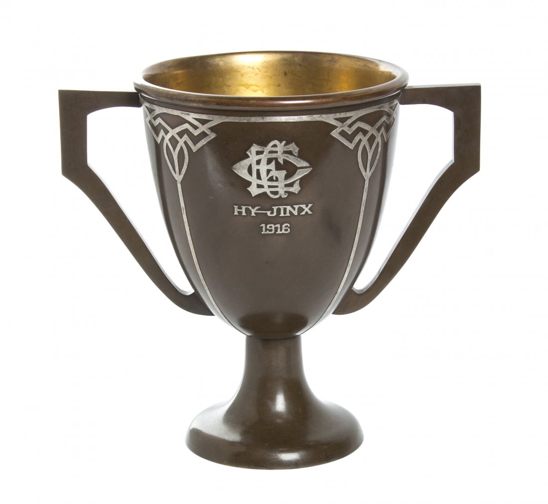 A Heintz Silver on Copper Trophy, Height 10 inches.: A Heintz Silver on Copper Trophy, of double handled form, having an applied intertwined EGC, dedication to Hy-Jinx, and dated 1916, further engraved Arbutus Cup award to W.B. Huey. Hei