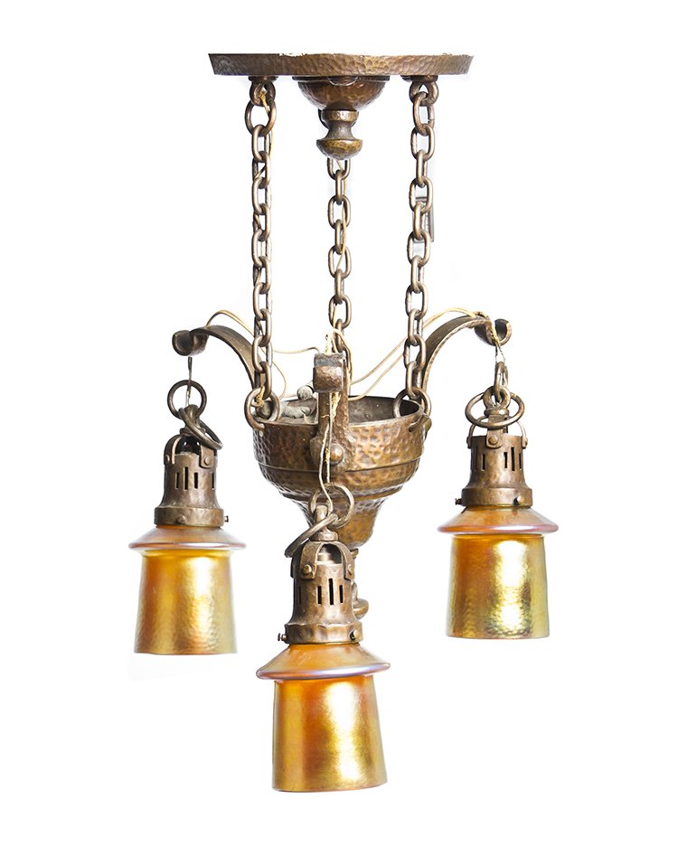 An Arts and Crafts Copper and Steuben Aurene Three-Ligh: An Arts and Crafts Copper and Steuben Aurene Three-Light Fixture, having a circular corona suspending the conical fixture with four pendant lighting elements, with hammered finish throughout, suspendi