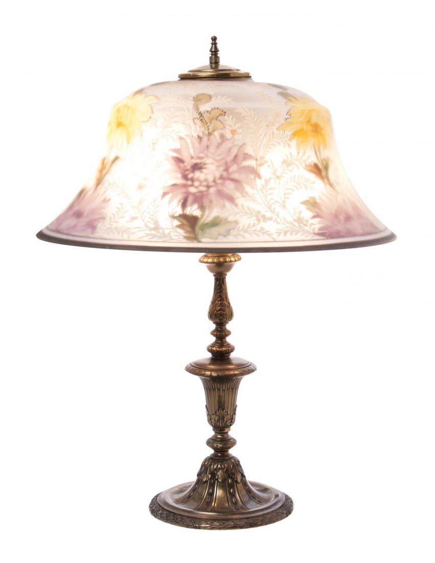 A Pairpoint Reverse Painted Glass Table Lamp, Diameter : A Pairpoint Reverse Painted Glass Table Lamp, the flared circular shade decorated with chrysanthemums and dusty millers, stamped The Pairpoint Corp'n., raised on the gilt metal baluster and foliate de