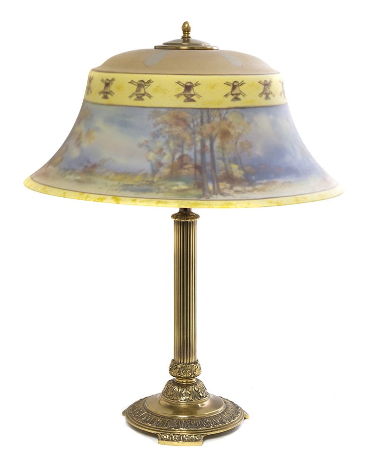 A Pairpoint Reverse Painted Table Lamp, Diameter of sha: A Pairpoint Reverse Painted Table Lamp, the flared circular shade decorated with a landscape and having a band of Dutch windmills, signed C. Durand, raised on the gilt metal columnar base, bearing the