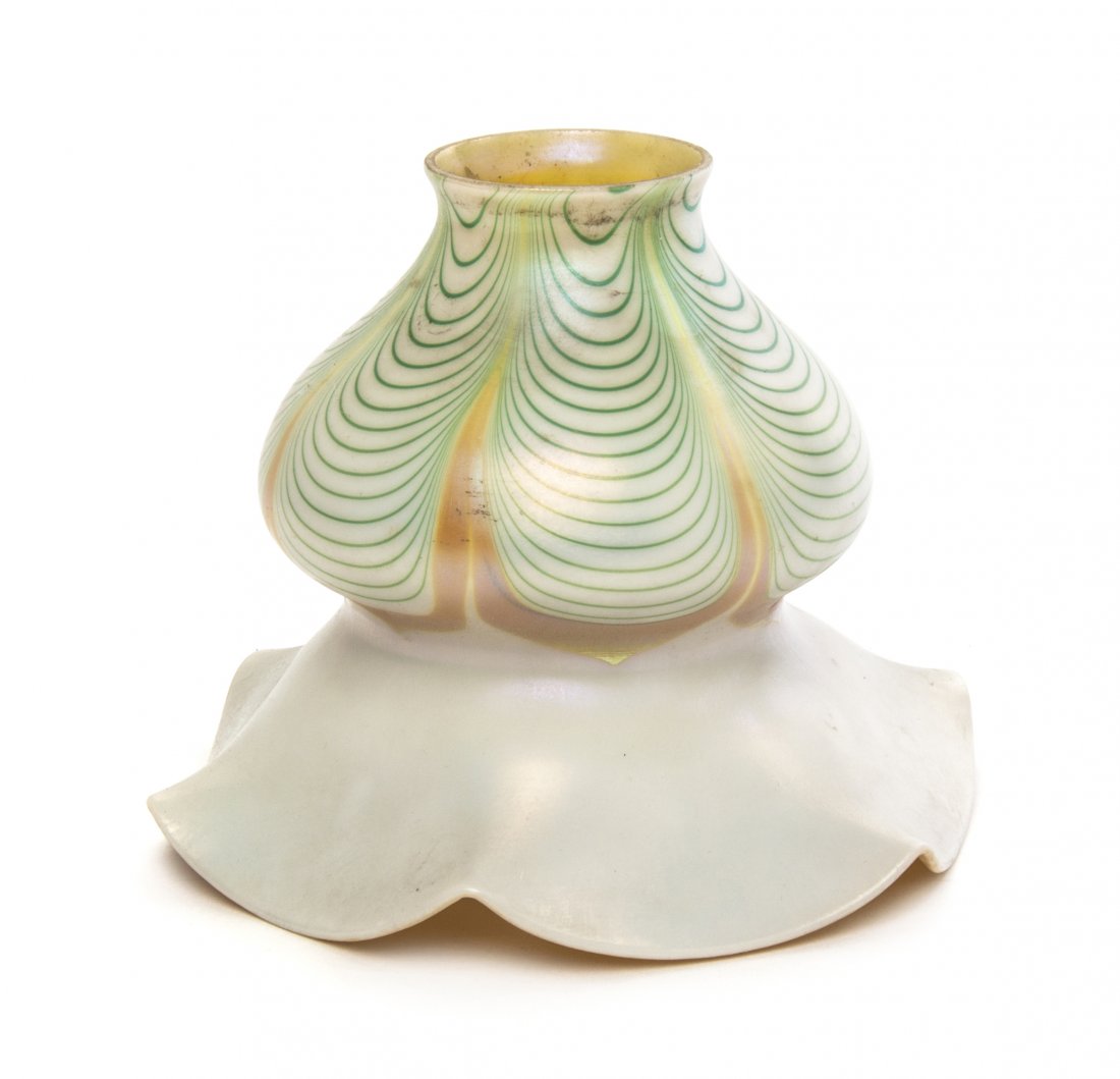 An Iridescent Glass Shade, likely Steuben, Height 5 1/4: An Iridescent Glass Shade, likely Steuben, having a ruffled rim and pulled feather decoration. Height 5 1/4 inches.