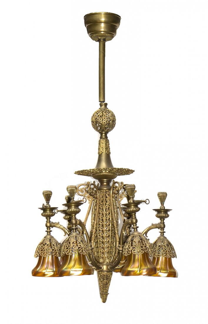A Victorian Gilt Metal and Steuben Gold Aurene Glass Li: A Victorian Gilt Metal and Steuben Gold Aurene Glass Light Fixture, having six pendant shades. Height overall 43 1/2 inches x height of shades 5 1/2 inches. Property from the Estate of Marvin and Marg