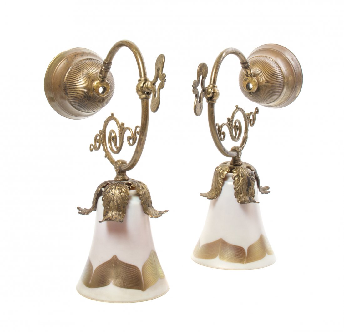 Two Quezal Iridescent Glass Shades, Height of shades 5 : Two Quezal Iridescent Glass Shades, each with pulled feather decoration, set in brass sconces. Height of shades 5 3/8 inches. Property from the Estate of Marvin and Margaret Katz, Naples, Florida