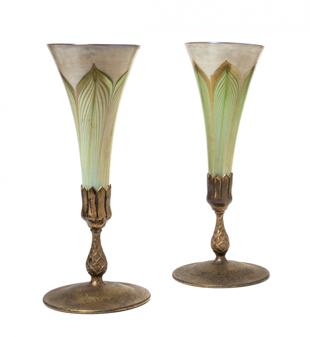 A Pair of Tiffany Studios Favrile Glass and Dore Bronze: A Pair of Tiffany Studios Favrile Glass and Dore Bronze Mounted Trumpet Vases, each insert of flared circular form with pulled feather decoration, signed L.C.T., above the artichoke standard, raised o