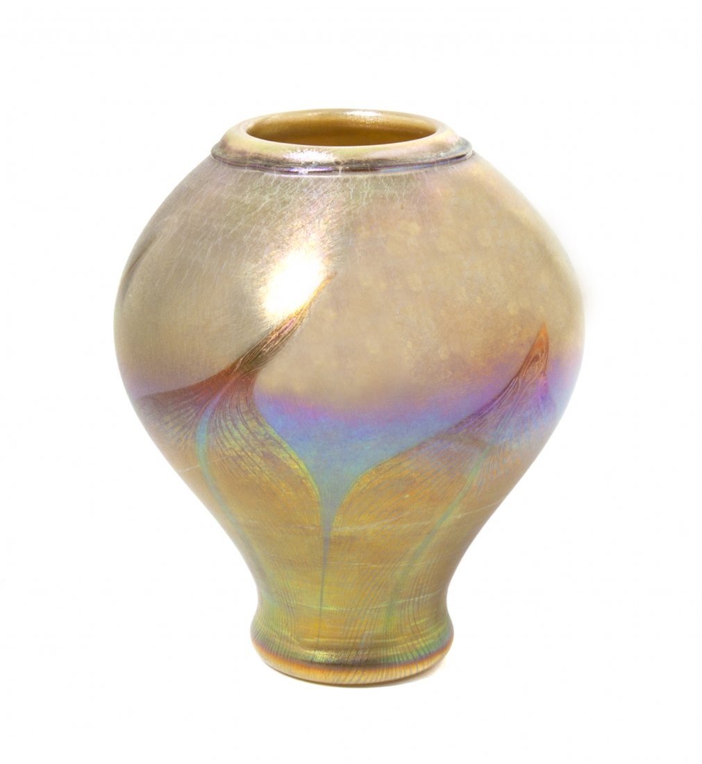 A Tiffany Studios Favrile Glass Vase, Height 7 inches.: A Tiffany Studios Favrile Glass Vase, of baluster form with pulled decoration in gold iridescence, signed L.C.T. K1149. Height 7 inches. Property from the Estate of Marvin and Margaret Katz, Naples, F