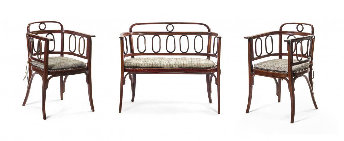 A Josef Hoffmann Bentwood Parlor Suite, for Thonet, Hei: A Josef Hoffmann Bentwood Parlor Suite, for Thonet, comprising a settee and two armchairs, each with a curved crest rail over the horizontal splat with inset ring and oval decoration, above a caned se
