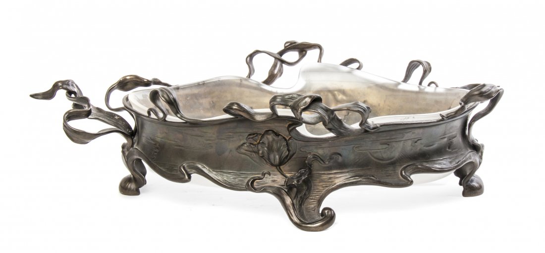 A WMF German Art Nouveau Frosted Glass and Silvered Met: A WMF German Art Nouveau Frosted Glass and Silvered Metal Center Bowl, Albert Kshler & Cie., of organic oval form, the insert having star cut decoration to the base, the frame with leaf, tulip and sun