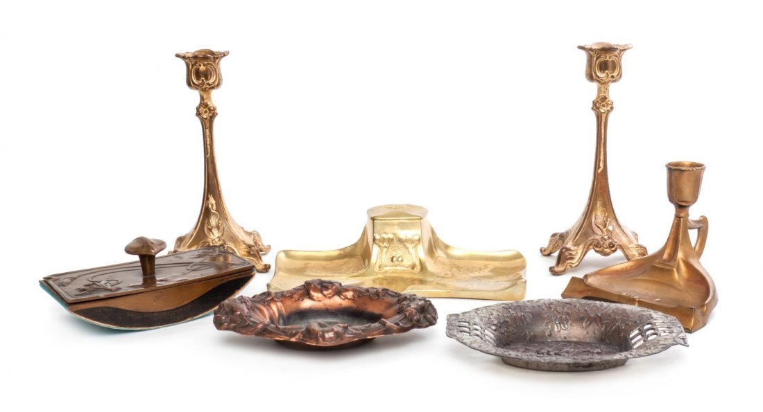 A Group of Art Nouveau Decorative Articles, Height of t: A Group of Art Nouveau Decorative Articles, comprising a pair of Jennings Brothers gilt metal candlesticks, a Royal Zinn coppered dish, an associated dish, a chamberstick, a rocker blotter and an encr