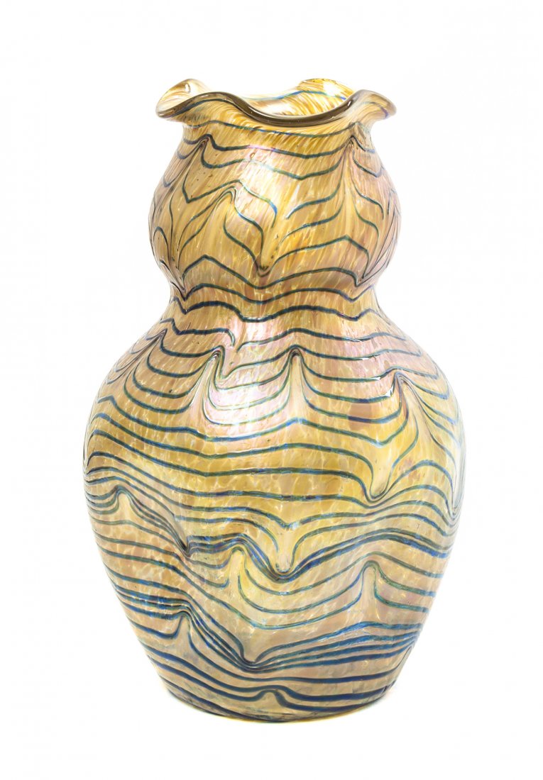 A Loetz Iridescent Glass Vase, Height 11 1/2 inches.: A Loetz Iridescent Glass Vase, in the Formosa pattern, of pinched baluster form with a ruffled rim, having pulled linear decoration. Height 11 1/2 inches. Property from the Collection of Mr. Ray Vahey