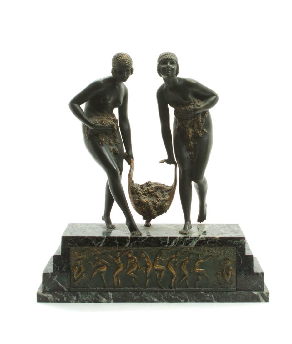 A French Bronze and Marble Figural Group, Demetre H. Ch: A French Bronze and Marble Figural Group, Demetre H. Chiparus (Romanian, 1886-1947), Jeunes Vendangeuses, depicting two Art Deco maidens carrying bundles of grapes, raised on a stepped marble base wit