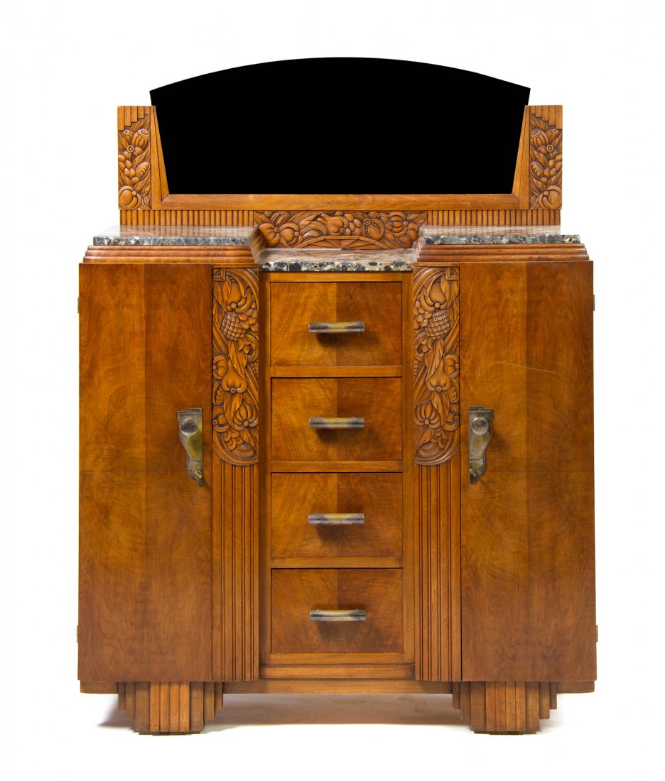 A French Art Deco Walnut Dining Suite, Height of first : A French Art Deco Walnut Dining Suite, comprising an extension table with two leaves, two marble top sideboards and a mirror, each with carved fruit decoration and six side chairs. Height of first 29 