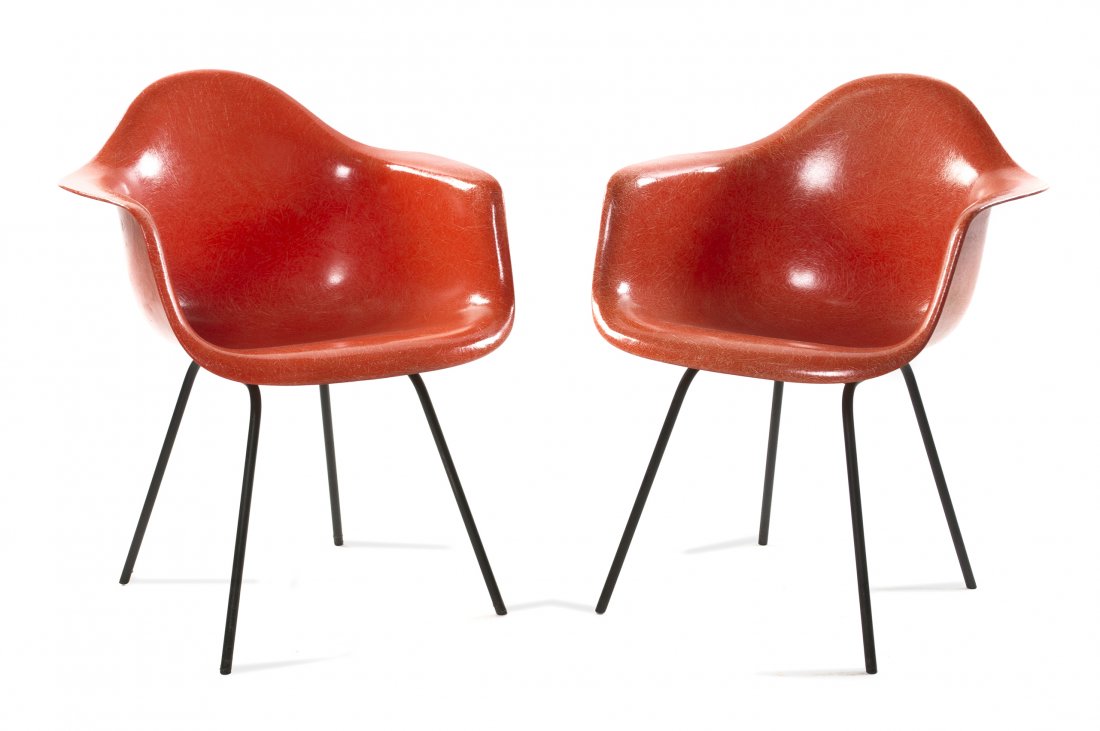 Two Charles and Ray Eames DAX Fiberglass Armchairs, Hei: Two Charles and Ray Eames DAX Fiberglass Armchairs, each with a molded back and seat, raised on tubular legs. Height 31 inches.
