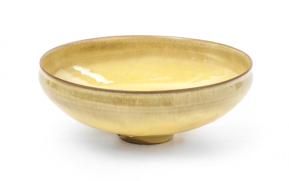 An Otto and Gertrude Natzler Ceramic Bowl, Diameter 6 3: An Otto and Gertrude Natzler Ceramic Bowl, of circular form with a yellow glaze. Diameter 6 3/4 inches.
