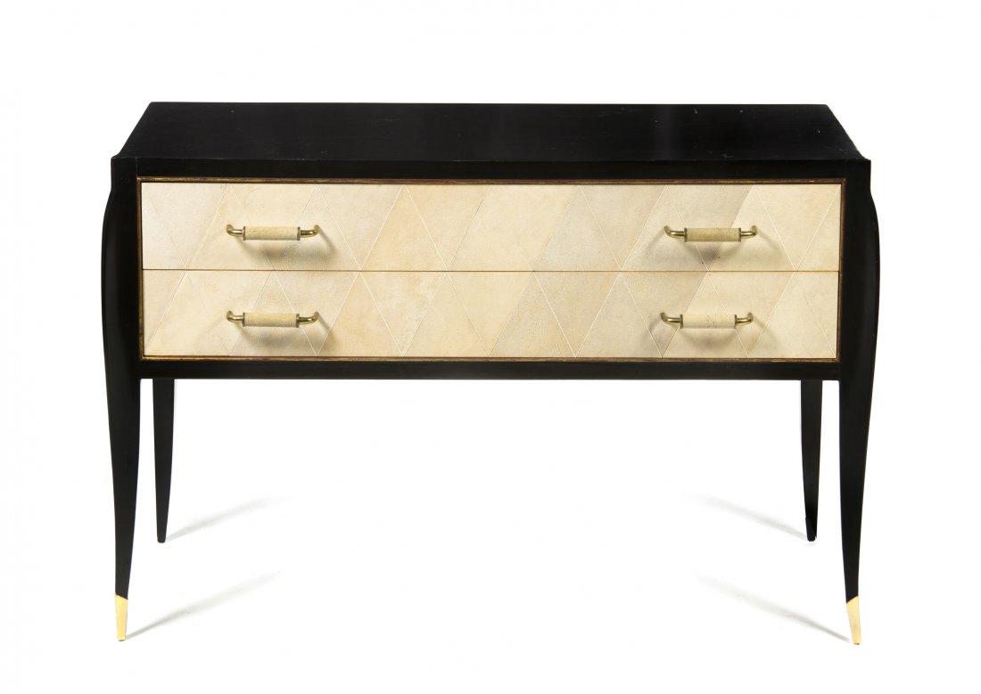 An Ebonized Wood and Shagreen Console Table, in the man: An Ebonized Wood and Shagreen Console Table, in the manner of Karl Springer, having a rectangular top over two drawers, raised on tapering legs ending in brass caps. Height 29 1/4 x width 44 x depth 1