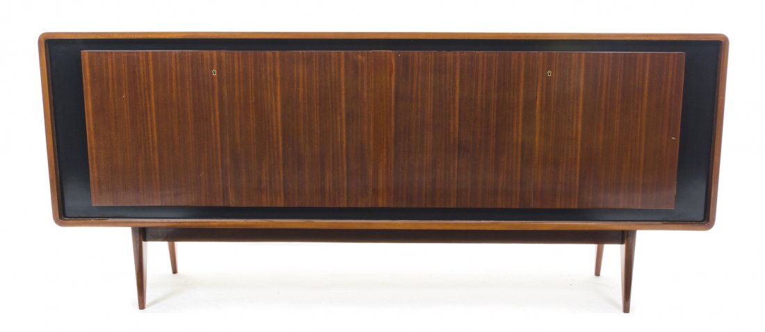 A French Modernist Mahogany Sideboard, Charles Ramos, H: A French Modernist Mahogany Sideboard, Charles Ramos, having a rectangular top with rounded corners over four paneled doors, raised on tapering legs. Height 34 3/4 x width 80 3/4 x depth 17 3/4 inches