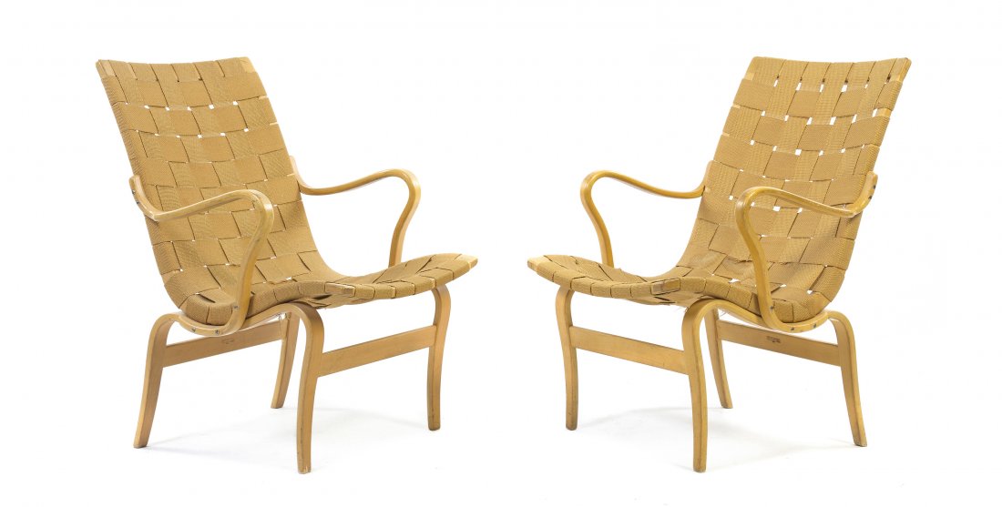A Pair of Bruno Mathsson Beech Armchairs, Height 33 inc: A Pair of Bruno Mathsson Beech Armchairs, each with a weaved back and seat within a bentwood frame, raised on curved legs joined by stretchers, marked Bruno Mathsson Made in Denmark. Height 33 inches.