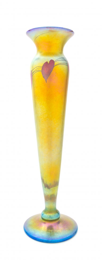 An American Iridescent Glass Vase, attributed to Lundbe: An American Iridescent Glass Vase, attributed to Lundberg Studios, of elongated baluster form with a band of red heart and vine decoration, raised on a circular foot, spuriously signed L.C. Tiffany Fa