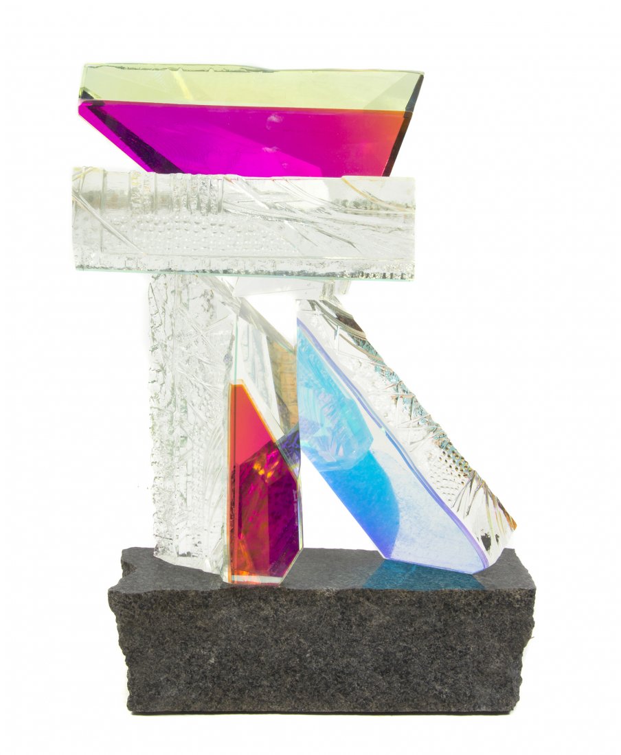 An American Studio Glass and Granite Sculpture, Grant M: An American Studio Glass and Granite Sculpture, Grant Miller, having five fused glass elements set on a polished base with rough hewn sides, etched Grant Miller 1989. Height 20 3/8 inches.