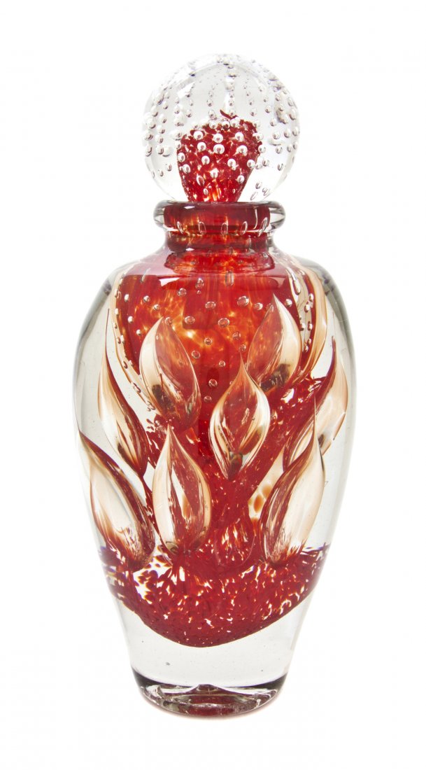 A French Studio Glass Vase, Jean-Claude Novaro (b. 1943: A French Studio Glass Vase, Jean-Claude Novaro (b. 1943), having a spherical stopper over the elongated ovoid body with internal air bubble and red decoration, signed J.C. Novaro and dated 2006 to bas