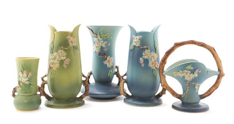 Five Roseville Pottery Articles, Height of tallest 10 1: Five Roseville Pottery Articles, each in the Apple Blossom pattern, comprising four handled baluster form vases and a basket, numbered 309-8, 381-6, 388-10, 389-10, 389-10, each marked Roseville USA.
