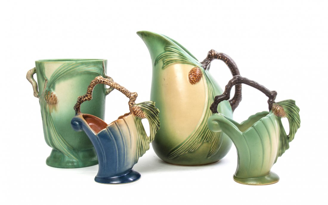 Four Roseville Pottery Articles, Height of tallest 9 in: Four Roseville Pottery Articles, each in the Pine Cone pattern, comprising a vase, two baskets and a ewer, each with a green or blue ground, three numbered 408, 408-6, 445-9. Height of tallest 9 inche