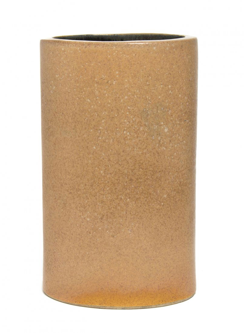 A Bauer Pottery Vase, designed by Russel Wright, Height: A Bauer Pottery Vase, designed by Russel Wright, of oval form having a speckled tan glaze, base impressed Bauer, Russel Wright in script. Height 10 3/8 inches.