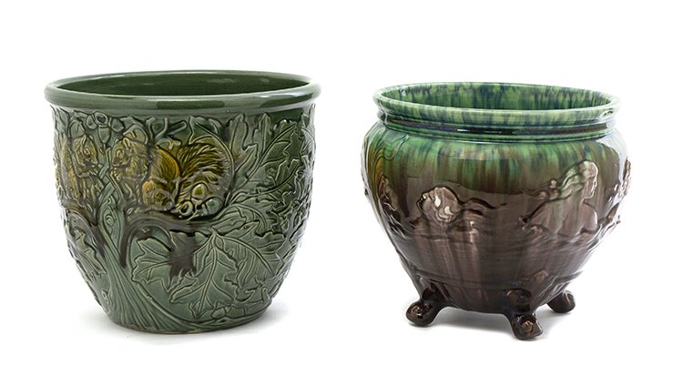 Two Weller Pottery Jardinieres, Height of taller 9 inch: Two Weller Pottery Jardinieres, one decorated with squirrels on oak branches, the other with sea nymphs, raised on three feet. Height of taller 9 inches. Property from the Estate of Ms. Jacqueline Kuz