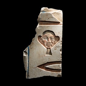 An Egyptian Painted Limestone Relief Fragment