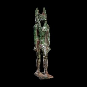 An Egyptian Bronze Striding Anubis